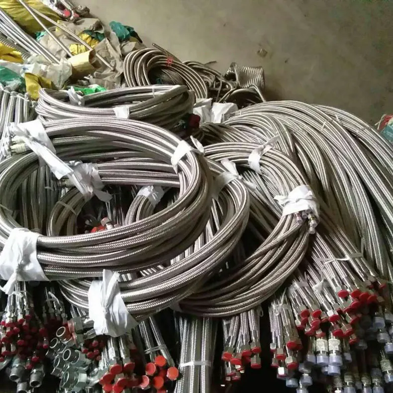 Coiled stainless steel braided hoses with protective caps, bulk stock